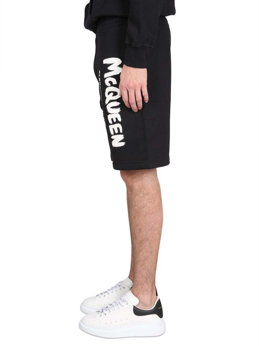 BERMUDA SHORTS WITH GRAFFITI LOGO PRINT