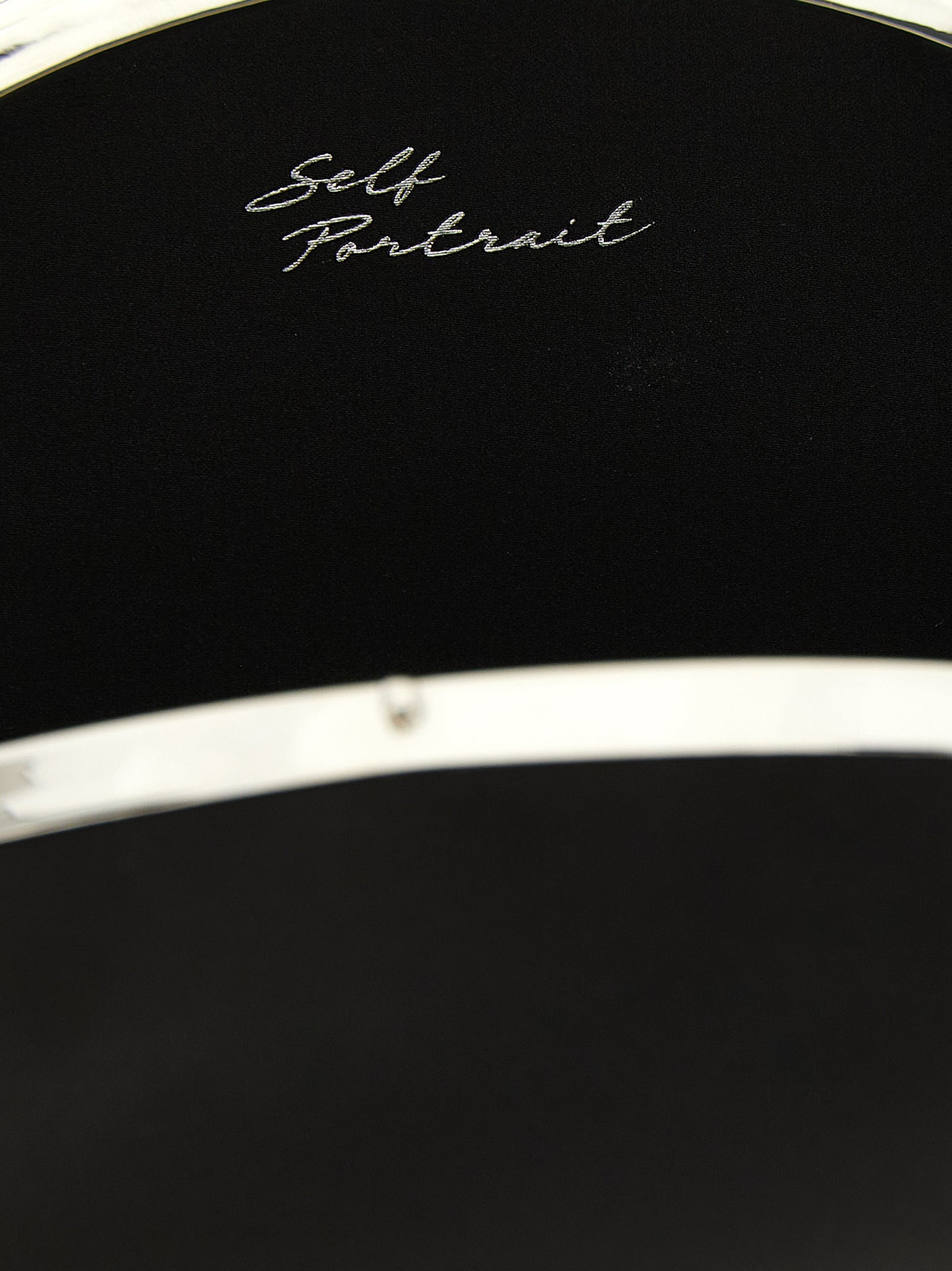 Oval satin clutch bag