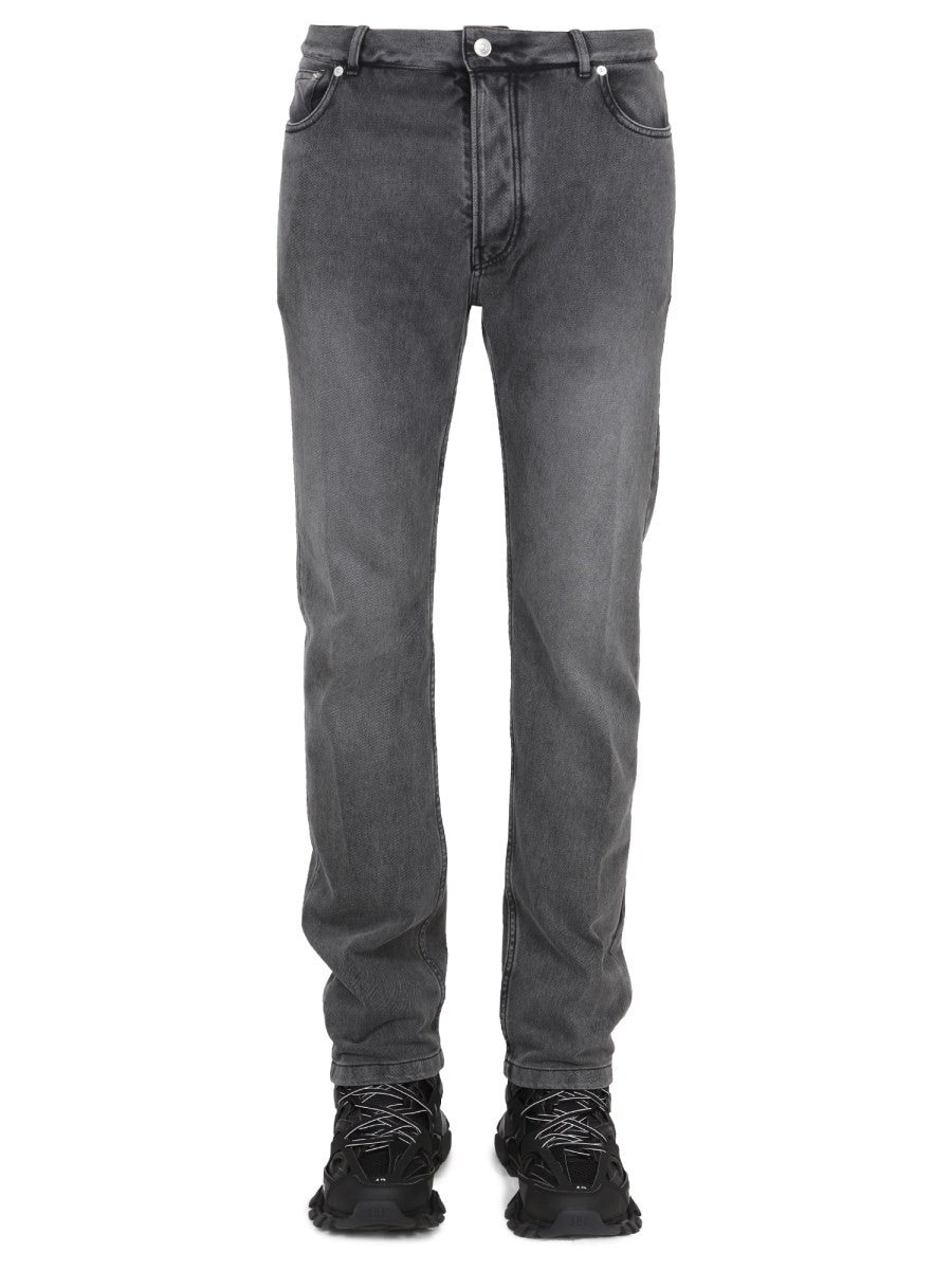 JEANS CON PATCH LOGO