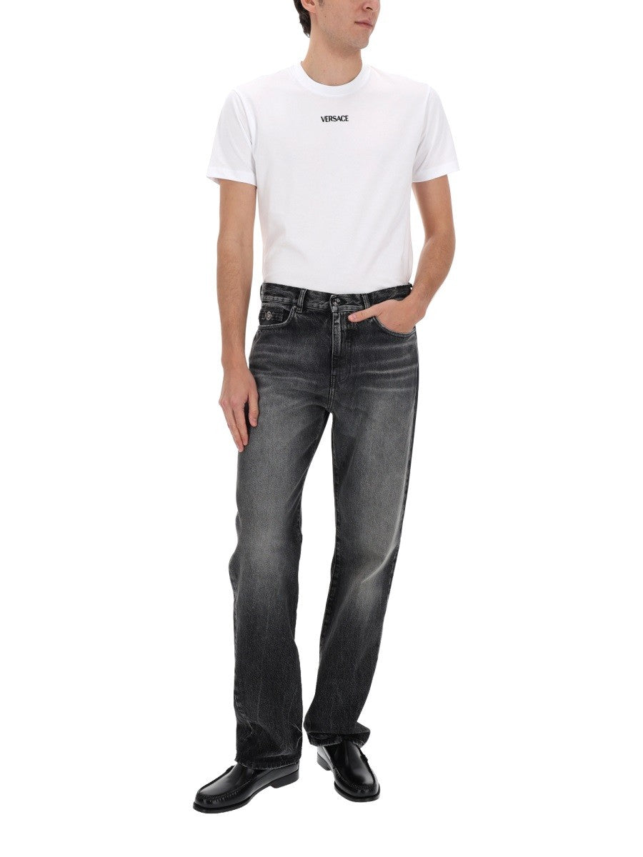 JEANS WITH "MEDUSA" DETAIL