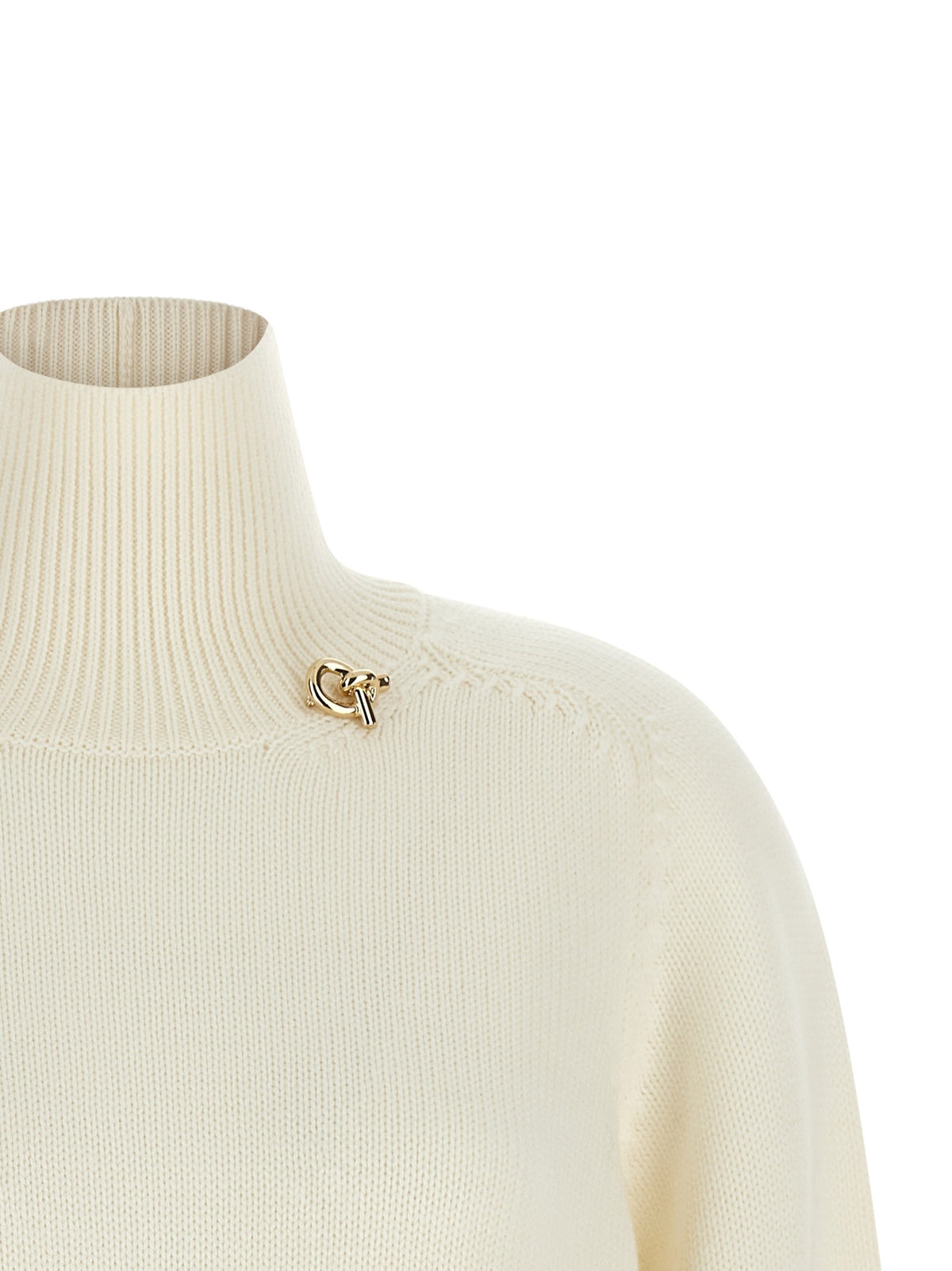 Knot pin sweater