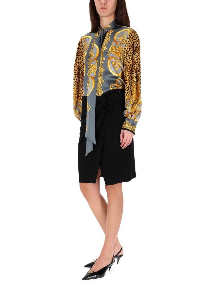 MIDI SKIRT WITH ASYMMETRICAL HEMLINE