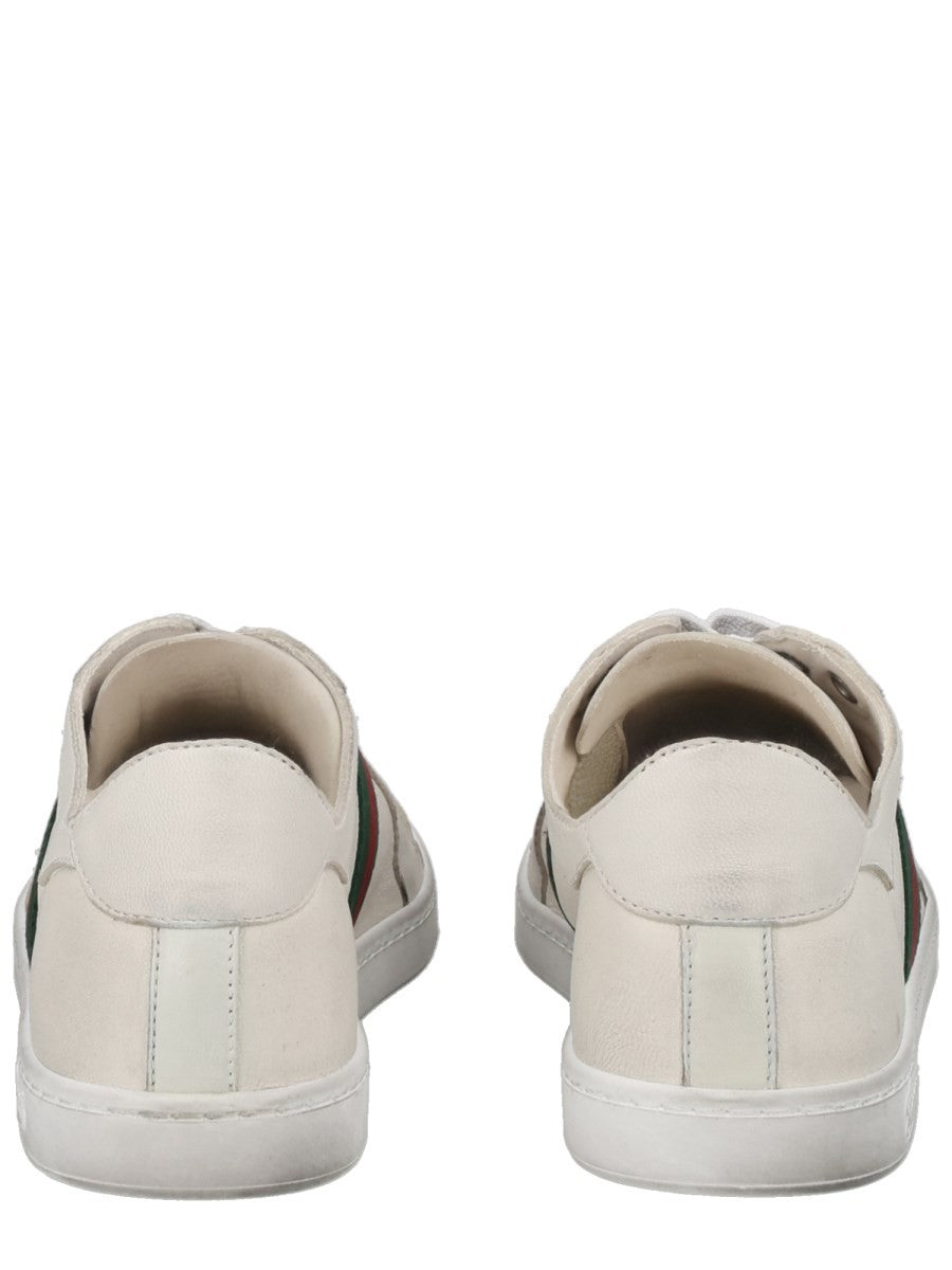 "STRETCH" LEATHER EFFECT SNEAKER