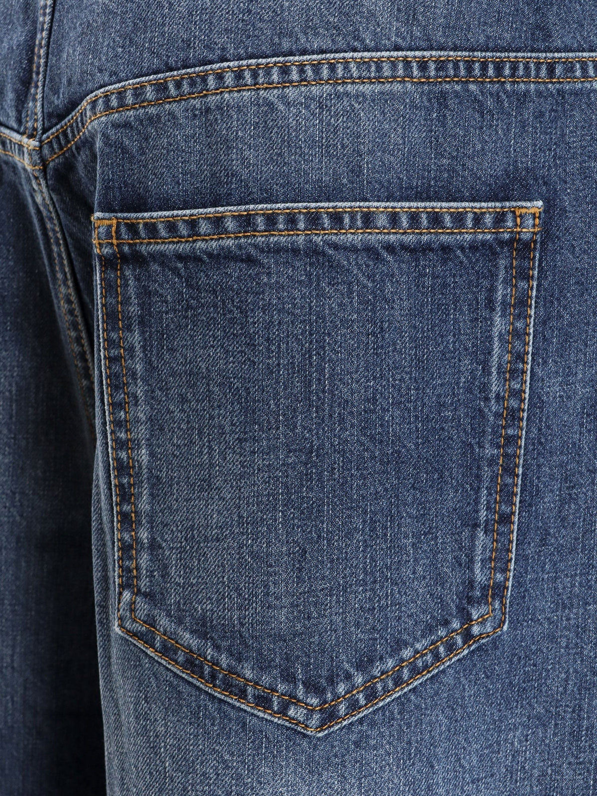 Twisted stone-washed denim jeans