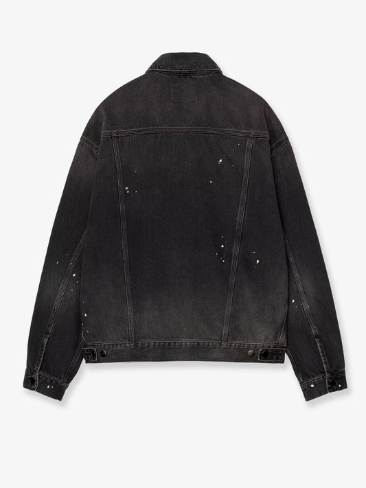 Black denim jacket with a distressed effect