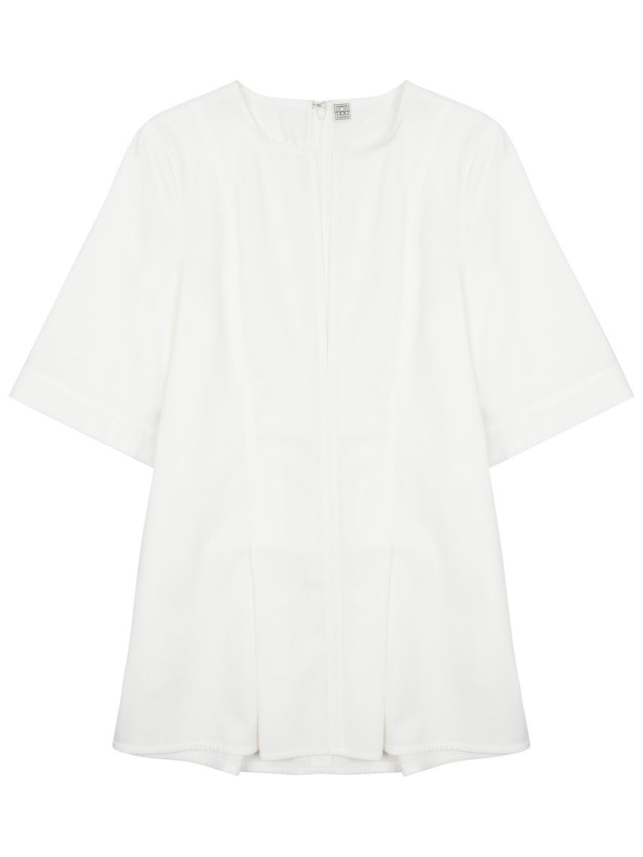 BLUSA PLISSETTATA CON SCOLLO A V