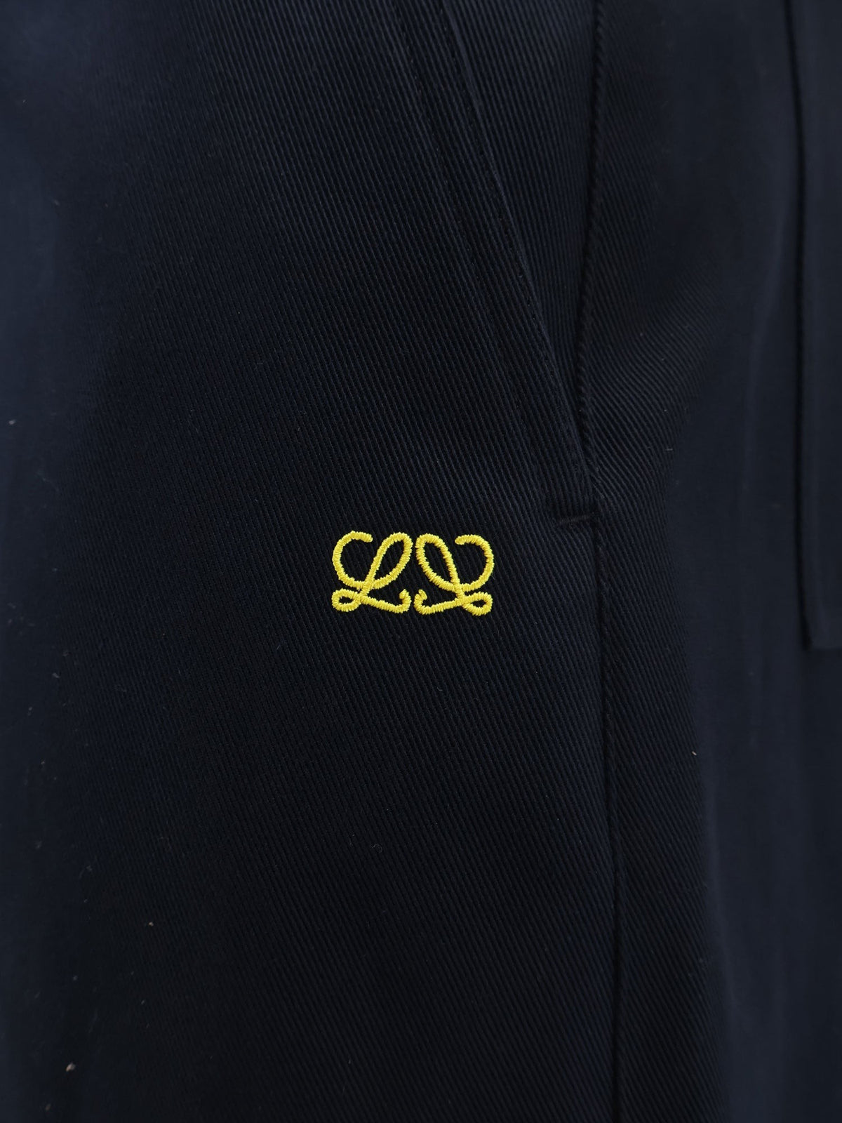 Denim trousers with contrasting embroidered logo