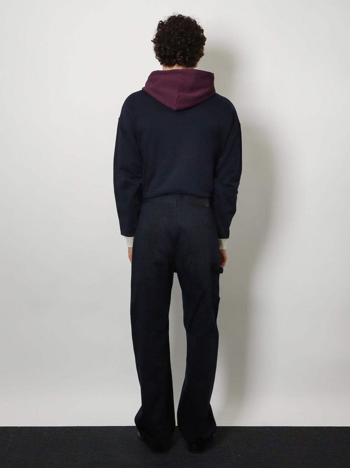 Denim trousers with contrasting embroidered logo