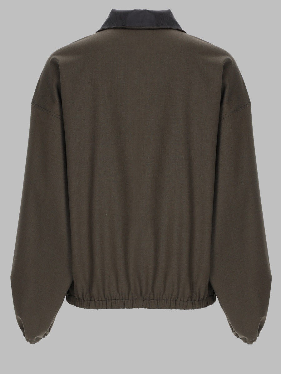 GIACCA CON ZIP A TRE QUARTI