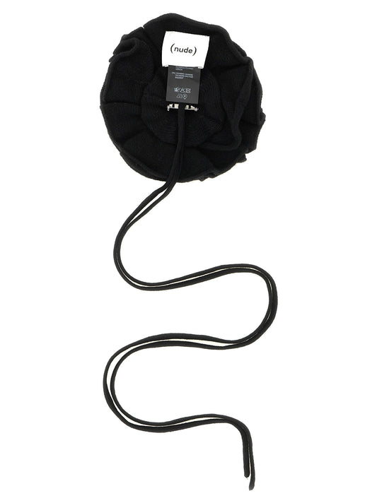 Knitted brooch with lace