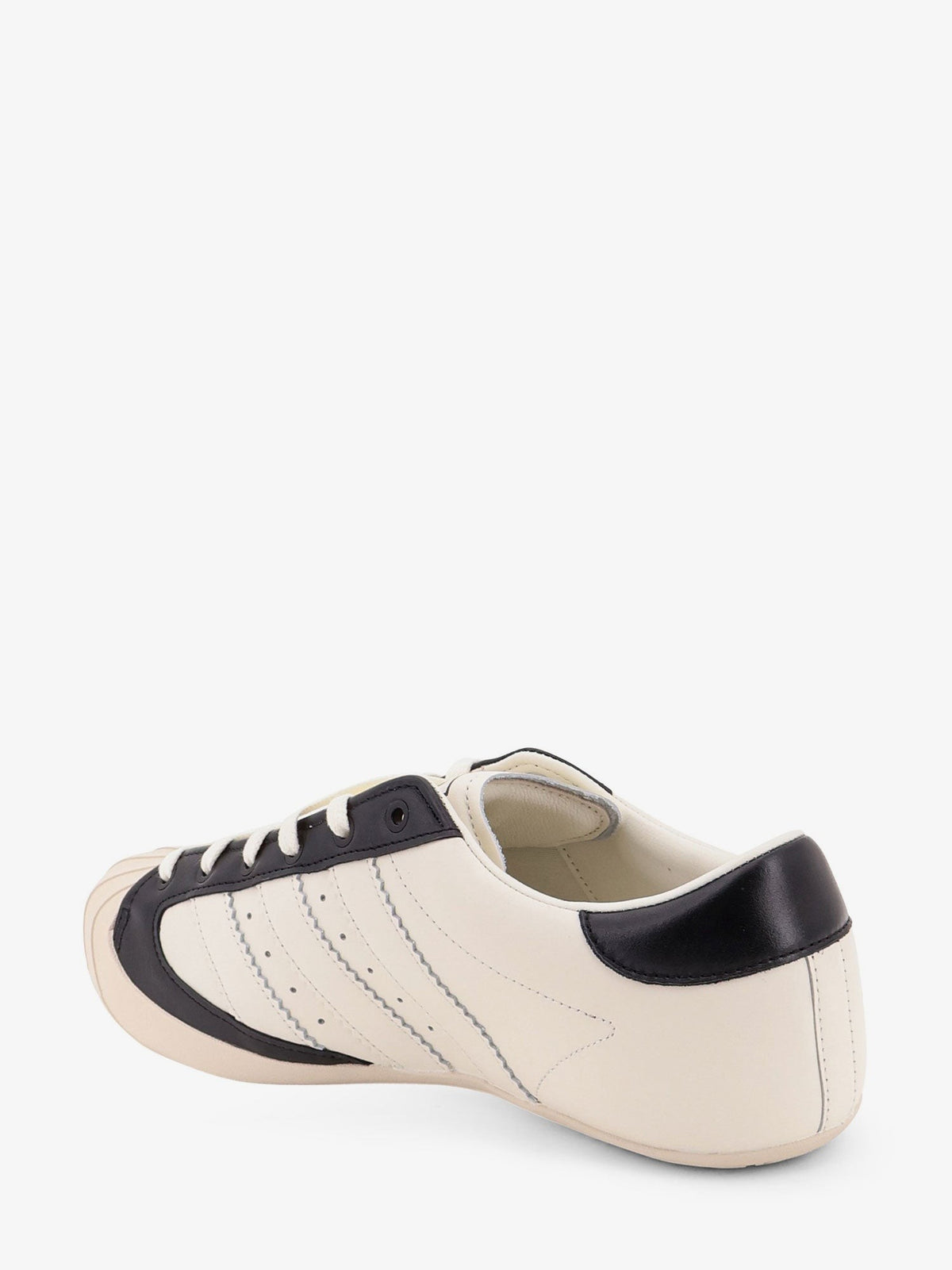 Leather and rubber sneakers