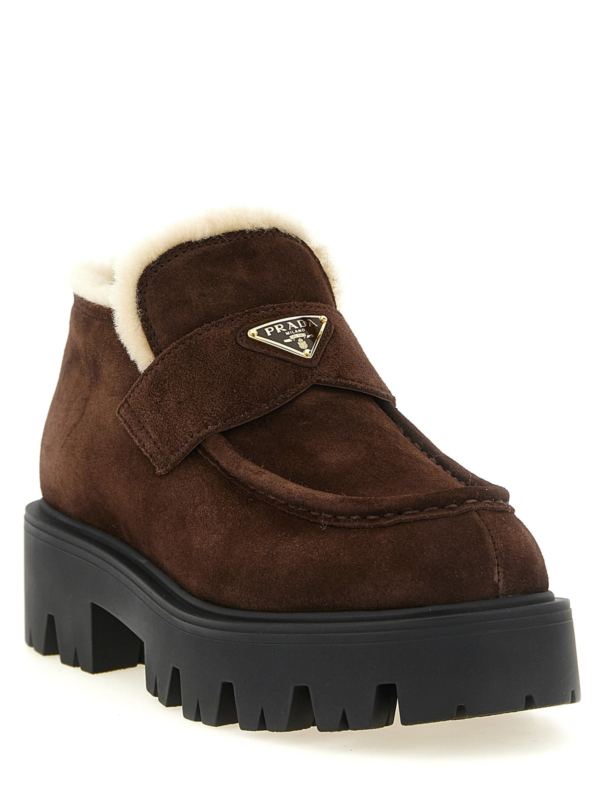 Loafers with fur and enamel logo