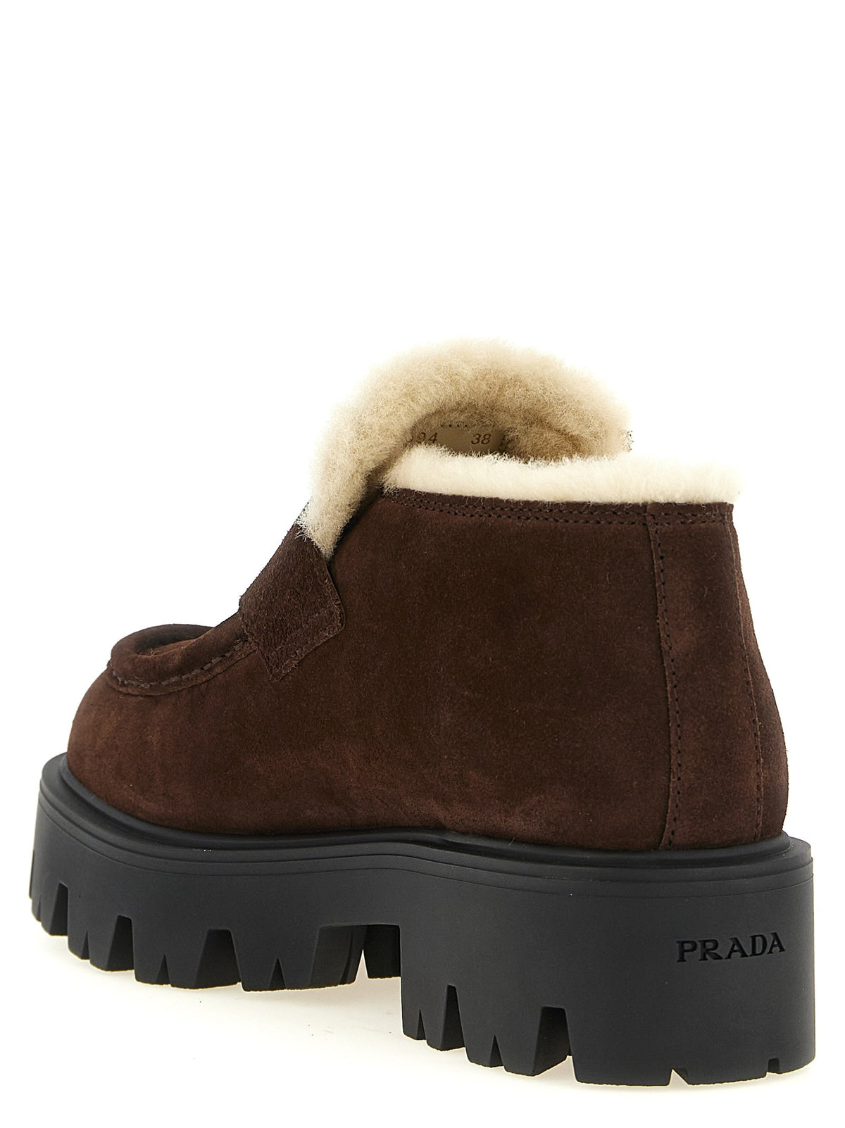 Loafers with fur and enamel logo